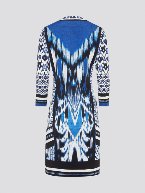 Make a statement with this striking blue printed long sleeve dress by Roberto Cavalli. The intricate design and flowing silhouette add a touch of elegance and drama to any outfit. Perfect for a night out or a special event, this dress is sure to turn heads and make you feel like a true fashion icon.