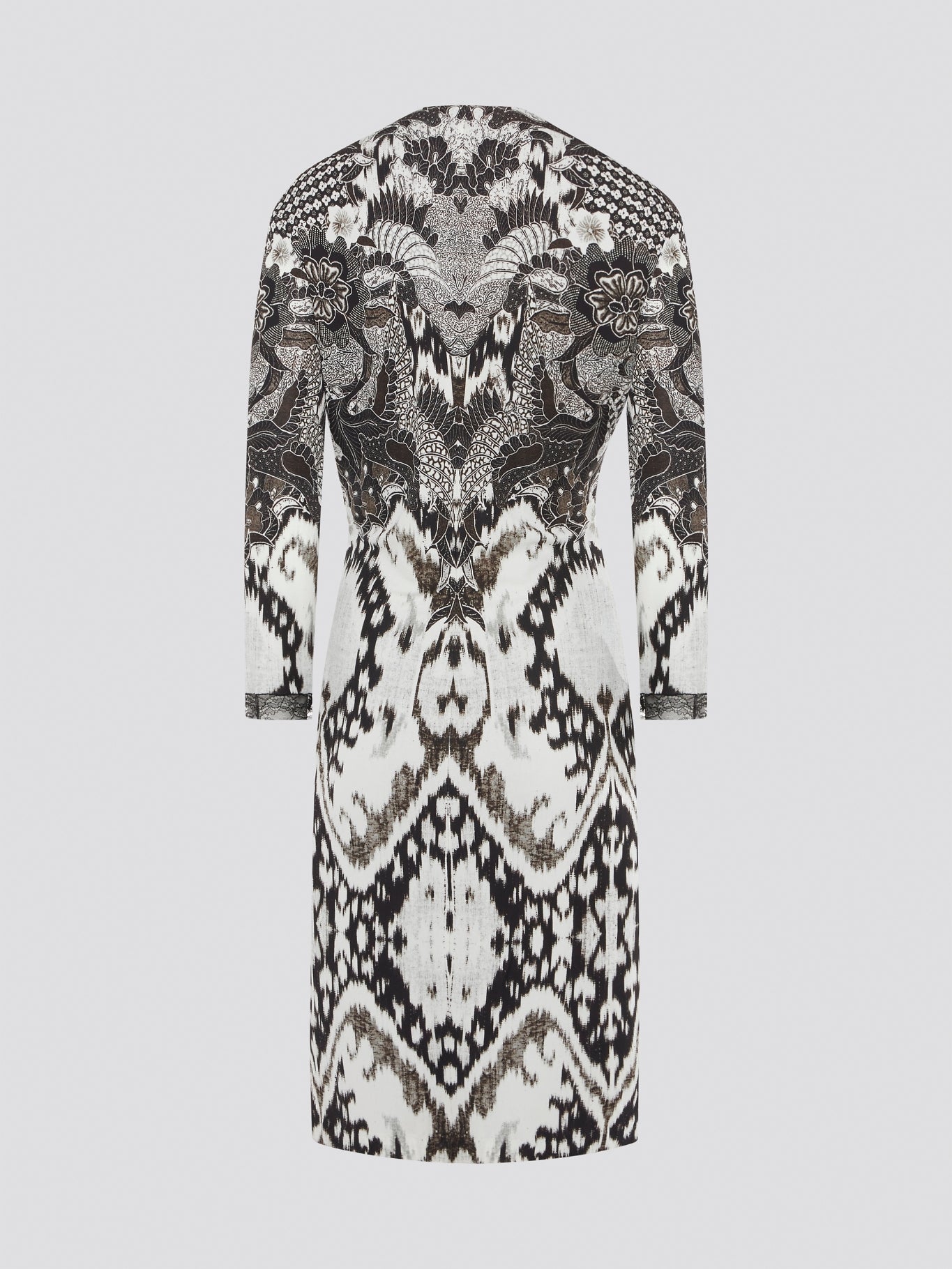 Elevate your wardrobe with this stunning Printed Long Sleeve Dress by Roberto Cavalli. The vibrant print and luxurious fabric make it a perfect choice for any special occasion or night out. Stand out in style and turn heads wherever you go in this show-stopping piece.