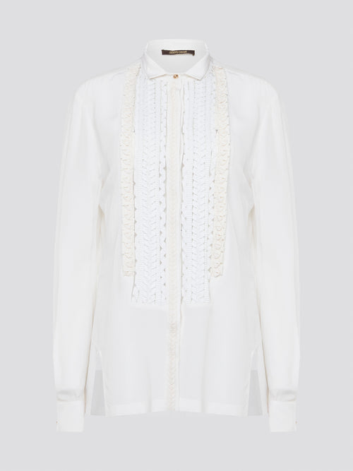 Elevate your wardrobe with this stunning Roberto Cavalli white detailed long sleeve shirt. Crafted with exquisite attention to detail, this shirt features intricate embroidery and embellishments that exude luxury and elegance. Perfect for adding a touch of sophistication to any ensemble, this statement piece is sure to turn heads wherever you go.