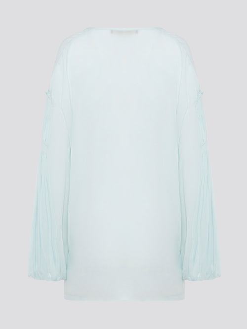 Step up your fashion game with this stunning Mint Green Tie Front Blouse by Roberto Cavalli. The delicate mint green hue and flattering tie front detail will make you stand out in any crowd. Pair it with your favorite jeans for a casual daytime look or dress it up with some sleek trousers for a night out on the town.