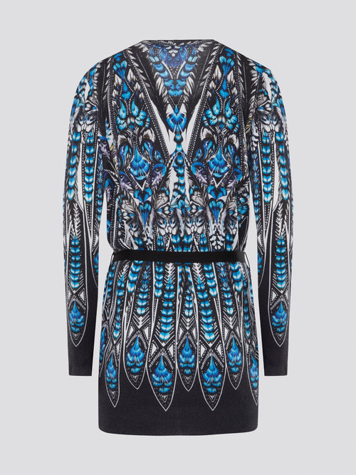 Step out in style with the Roberto Cavalli Printed Tie-Front Cardigan - a chic and sophisticated addition to any outfit. The luxurious fabric and intricate print combine to create a truly eye-catching piece that will effortlessly elevate your wardrobe. Whether paired with jeans for a casual look or layered over a dress for a night out, this cardigan is sure to become a staple in your closet.