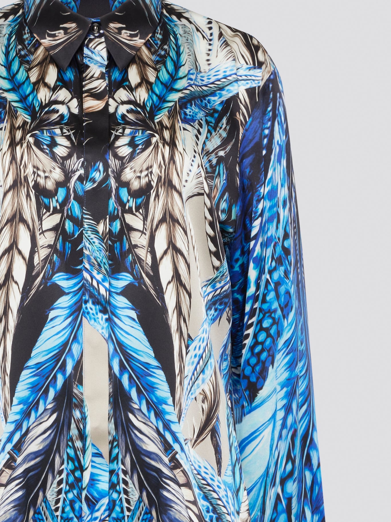 Elevate your wardrobe with the stunning Blue Printed Long Sleeve Blouse by Roberto Cavalli. Featuring a bold and striking print, this blouse is perfect for making a statement wherever you go. Crafted with exquisite attention to detail, this piece will add a touch of luxury and sophistication to any outfit.