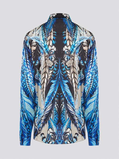 Elevate your wardrobe with the stunning Blue Printed Long Sleeve Blouse by Roberto Cavalli. Featuring a bold and striking print, this blouse is perfect for making a statement wherever you go. Crafted with exquisite attention to detail, this piece will add a touch of luxury and sophistication to any outfit.