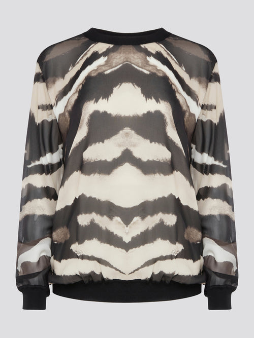 Make a fierce fashion statement with the Roberto Cavalli Zebra Print Sweatshirt, featuring a bold and eye-catching zebra print design. Crafted from premium materials, this sweatshirt offers both style and comfort for all-day wear. Elevate your street style with this standout piece that is sure to turn heads wherever you go.