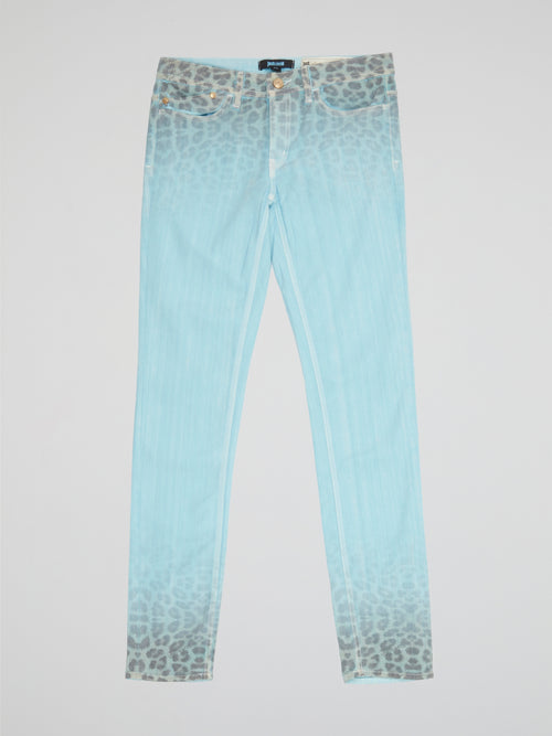 Unleash your wild side with these Blue Leopard Gradient Pants by Just Cavalli. Crafted from luxurious fabric that hugs your curves in all the right places, these pants feature a mesmerizing gradient pattern that transitions from deep indigo to fierce leopard print. Step out in style and make a statement with these bold and trendy pants that are sure to turn heads wherever you go.